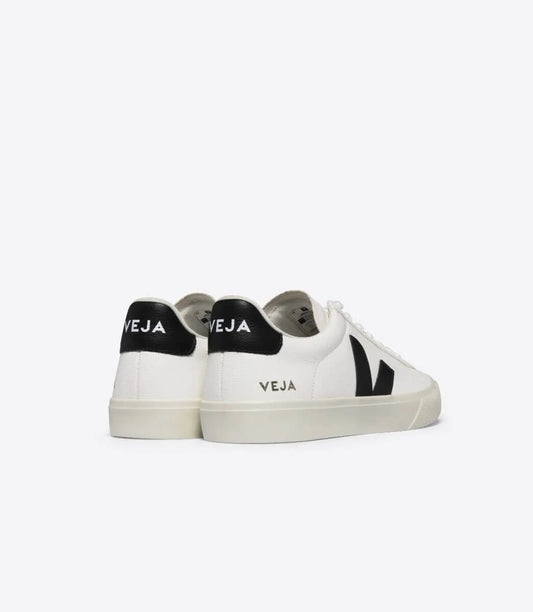 White Veja Campo sneakers with black V logo and heel tab by JP SUS in a side and back view